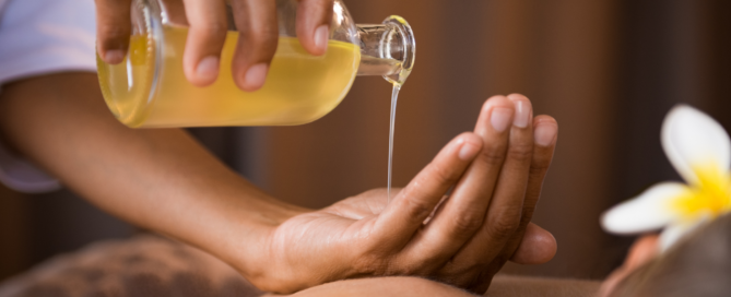 oil pouring on hands during Aromatherapy in Massage